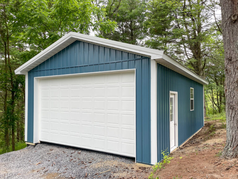 Featured Project 4 blue one car pole barn garage in Saylorsburg PA with white garage door