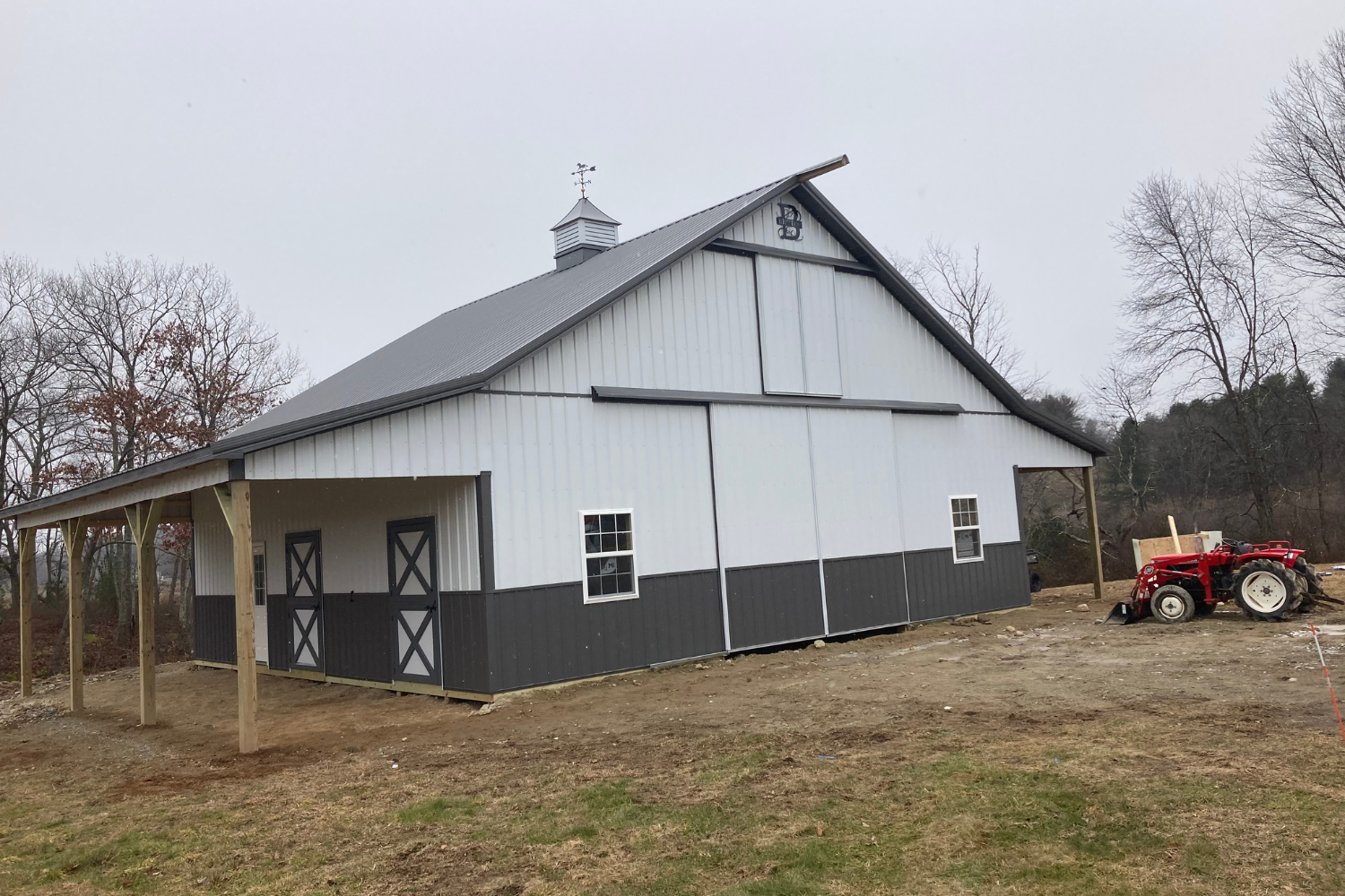 gray and white pole barn for livestock
